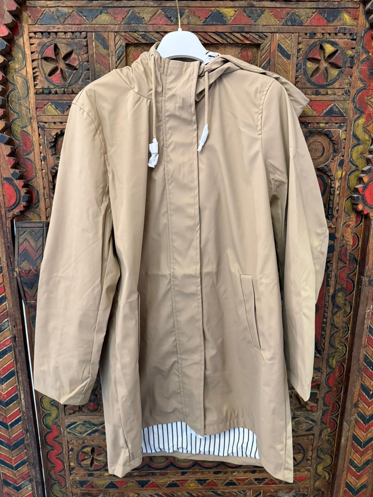 TE protege | Capa de Chuva